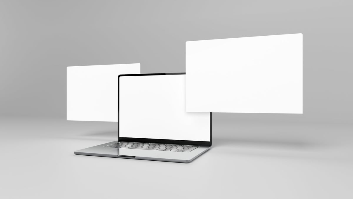 Laptop screens showing website design mockups